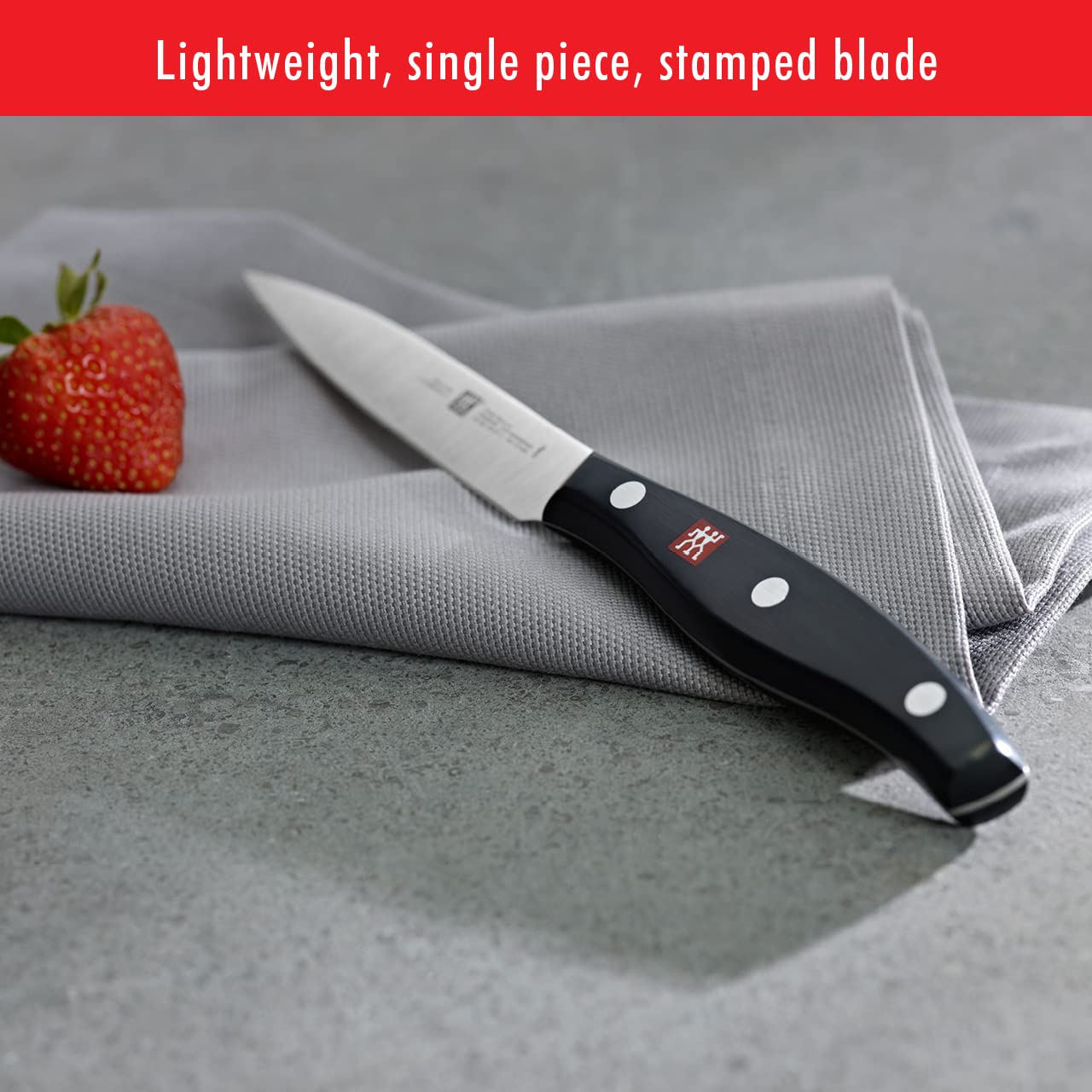 ZWILLING paring knife peeling an apple for fine control and accuracy